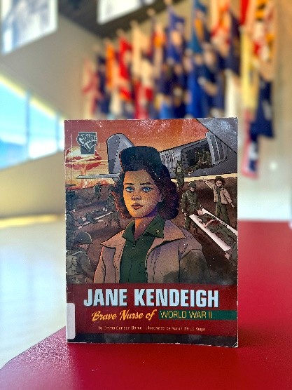 Book on table titled "Jane Kendeigh: Brave Nurse of World War II"