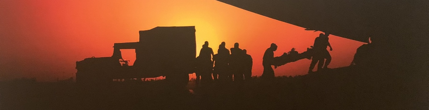 Silhouetted medic truck surrounded by people, ©Stacy Pearsall