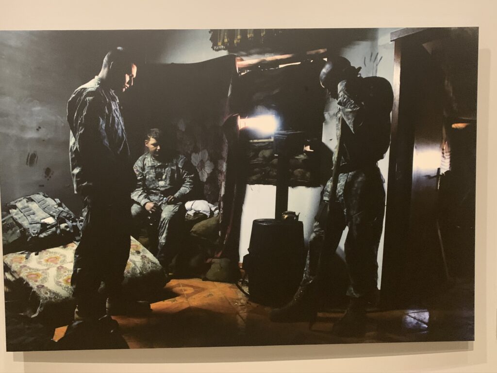 Trio of active duty servicemembers standing in repose in a small room, ©Stacy Pearsall