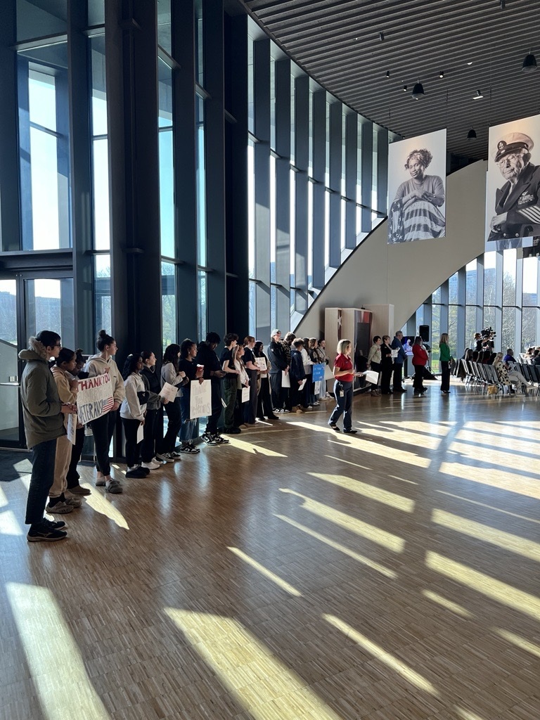 Students from Gahanna-Lincoln High School holding their signs up during the Vietnam War Veterans Day ceremony in 2025.