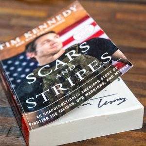 "Scars and Stripes" book cover for Wellness Weekend